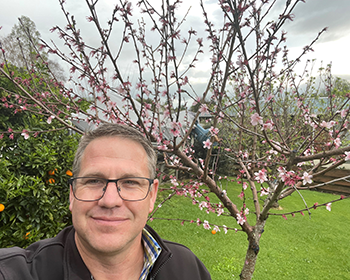 Steven in his mini fruit orchard